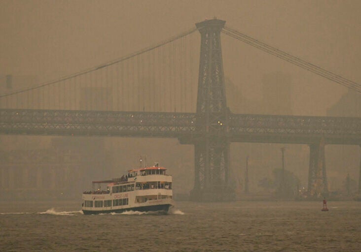 Gray and yellowish smoke limits visibility in photo.