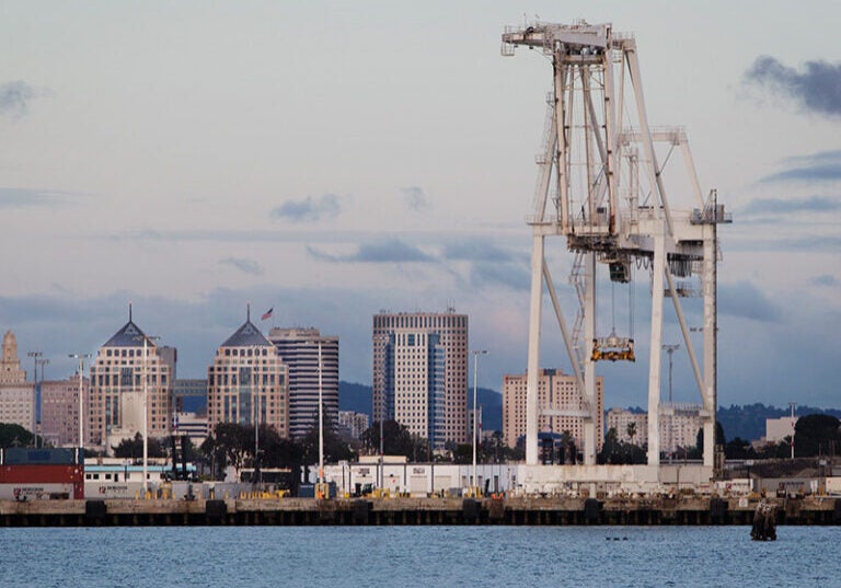 The Oakland skyline, behind the Port of Oakland.