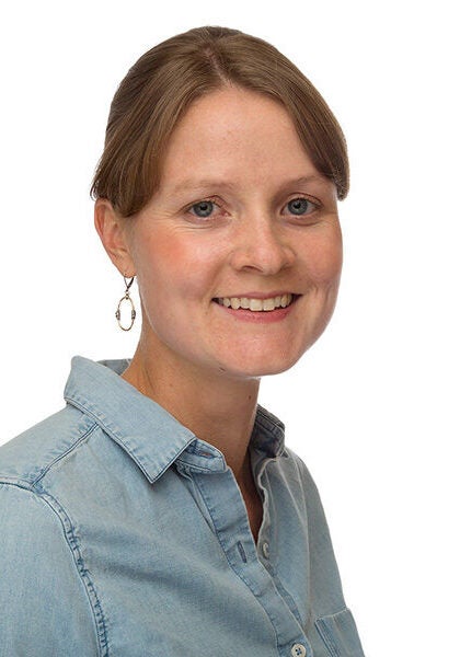 Katherine O'Brien, deputy managing attorney of Earthjustice's Toxic Exposure and Health program, is smiling, looking at the camera.