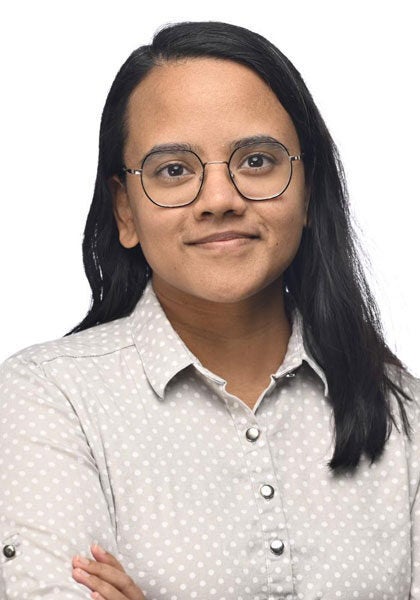 Rumela Roy, Senior Attorney with Earthjustice's Oceans Program, is smiling at the camera.