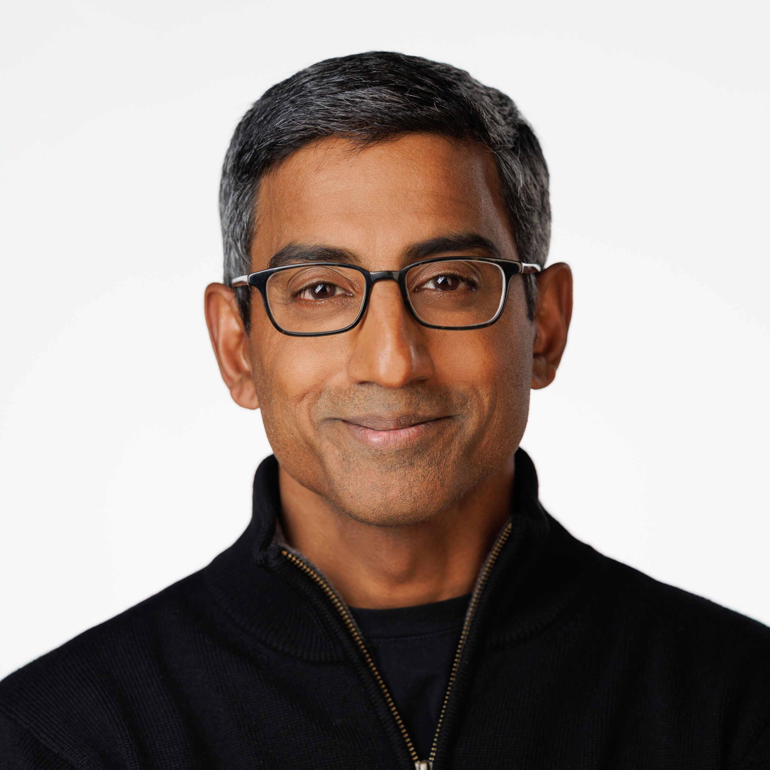 Sam Sankar is smiling and looking at the camera.