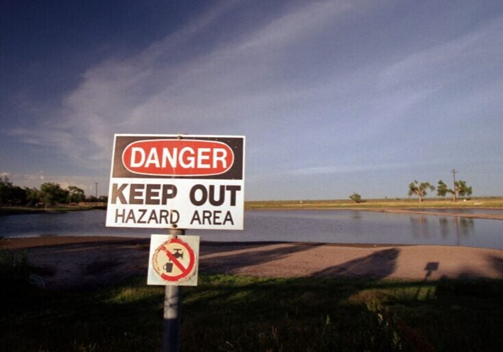 A warning sign posted near a pond contaminated with trichloroethylene and other hazardous chemicals at the former Reese Air Force Base near Lubbock, Texas.