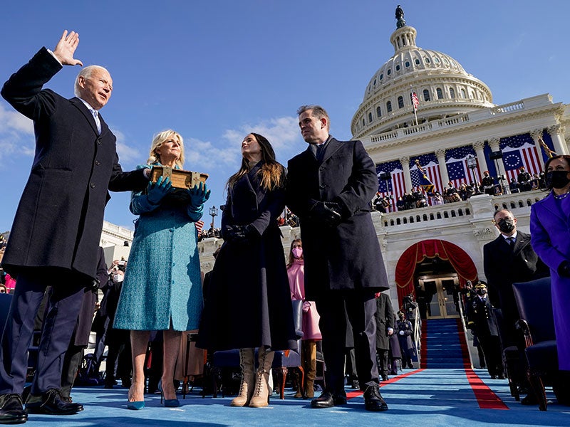 Joe Biden is sworn in as the 46th president of the United States by Chief Justice John Roberts as Jill Biden holds the Bible during the 59th Presidential Inauguration at the U.S. Capitol in Washington, Wednesday, Jan. 20, 2021, as their children watch.