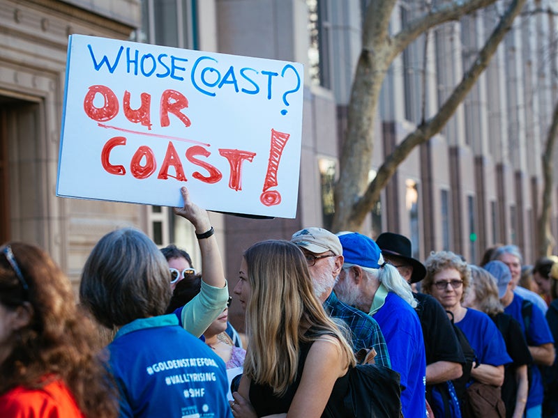 A line forms outside of the public hearing about President Trump’s plans to expand offshore oil drilling.