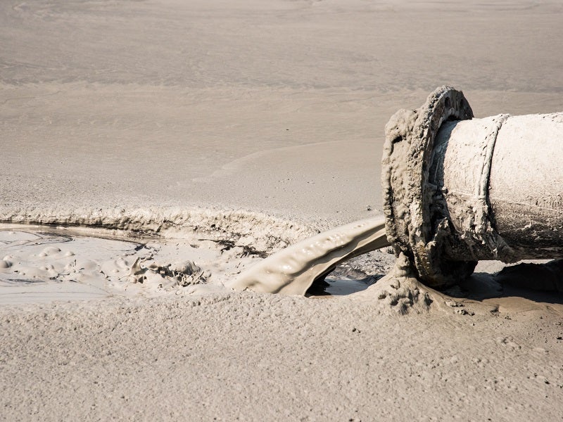 closeup of coal ash disposal pipe