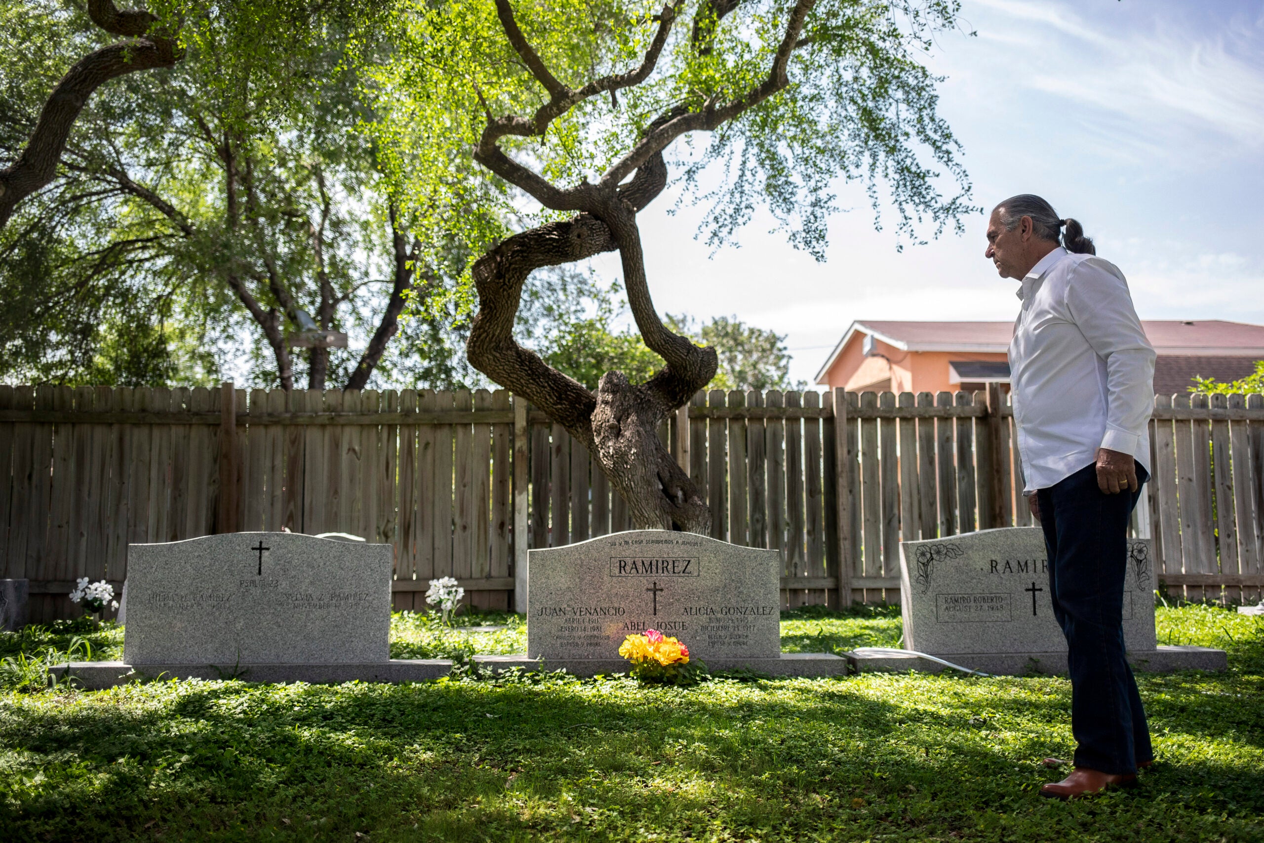 Ramiro Ramirez visits his parents&#039; graves at Jackson Ranch Cemetery in Texas. Trump&#039;s wall would make such visits harder.