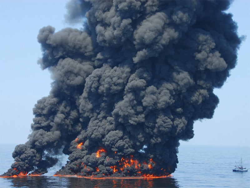A controlled burn of oil from the BP oil spill sends towers of fire hundreds of feet into the air over the Gulf of Mexico on June 9, 2010. More than 200 million gallons of oil polluted the Gulf of Mexico during the 201 BP Deepwater Horizon disaster. (PO1 James Masson / U.S. Coast Guard)
