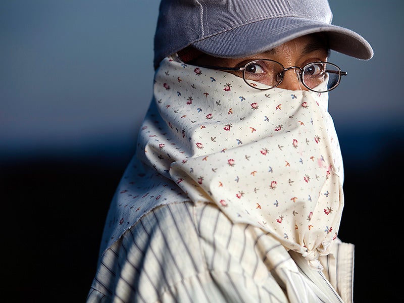 Maria Aguilera, a farmworker for 24 years, has learned to protect herself from toxic chemicals applied to the fields.
