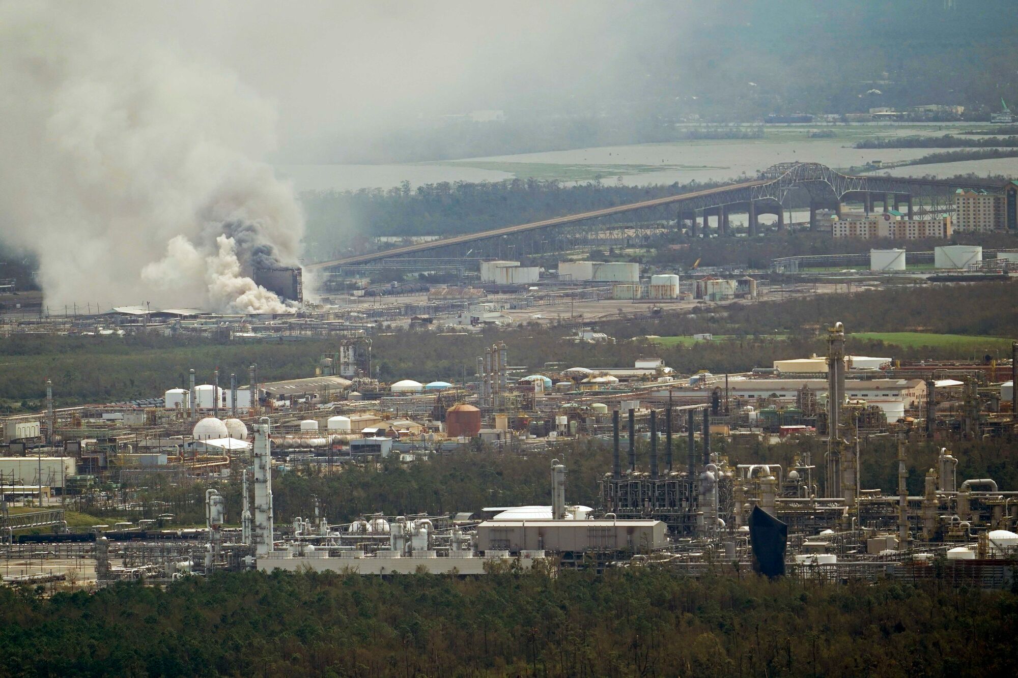 A chemical fire burns at a facility during the aftermath of Hurricane Laura Thursday, Aug. 27, 2020, near Lake Charles, LA.