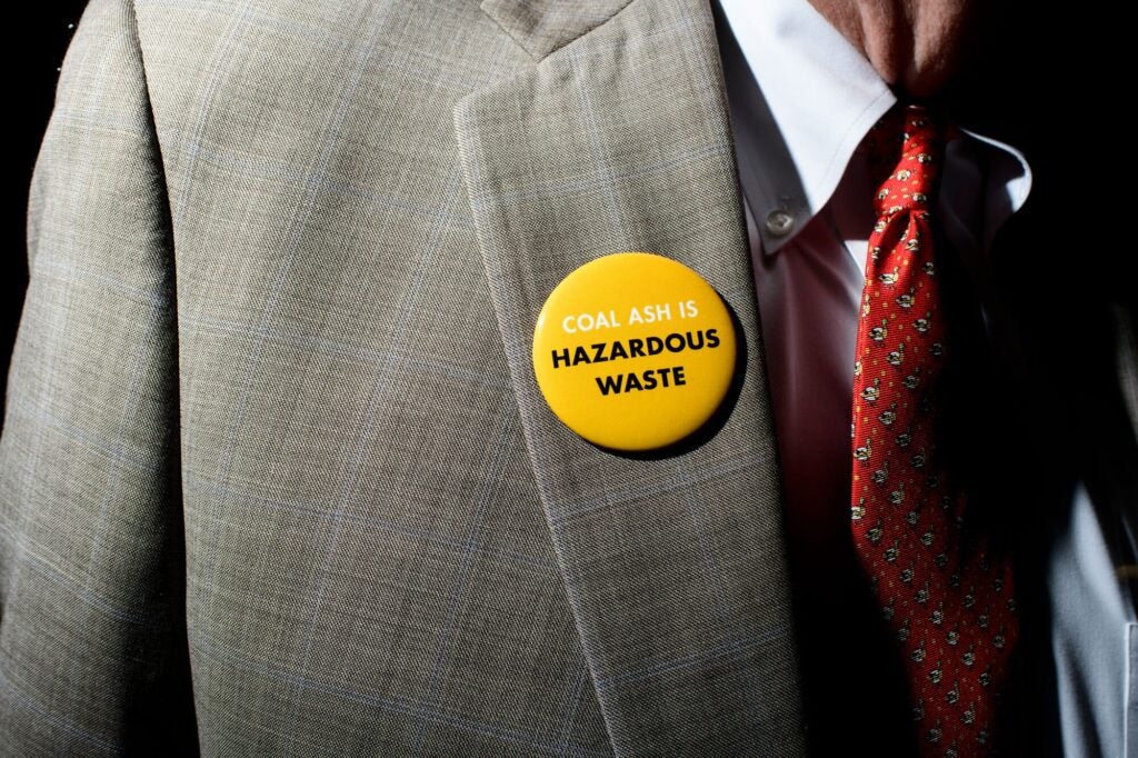 Coal ash contaminates our lives. A speaker wears a button during the U.S. EPA's public hearing on April 24, 2018.
(Matt Roth for Earthjustice)