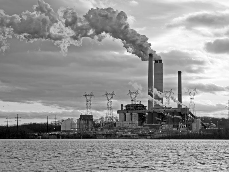 A coal fired power plant spews smoke into the air.
(Michael G McKinne / Shutterstock)