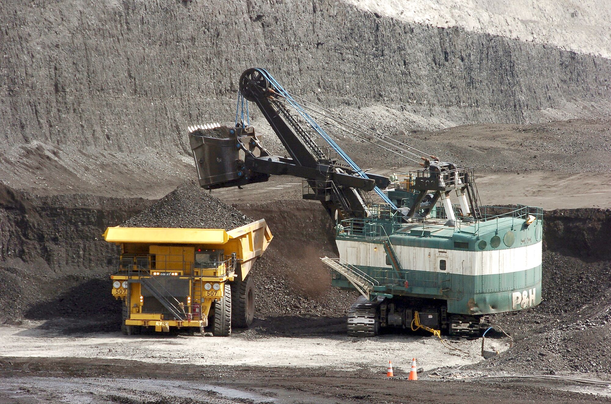 A mechanized shovel loads a haul truck that can carry up to 250 tons of coal.
