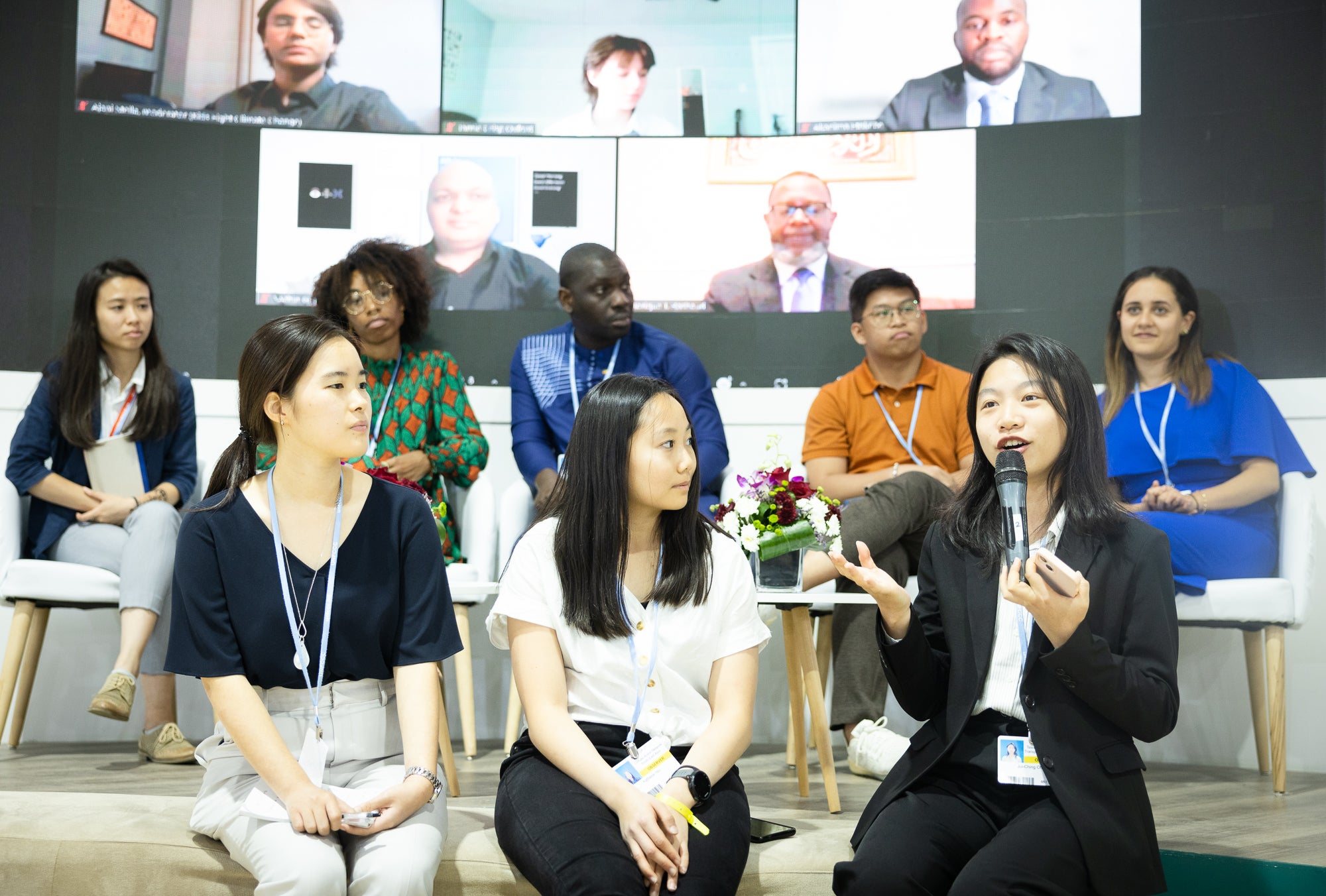 Youth representatives from the Philippines, Taiwan, Nigeria, and more, speak on a panel on climate justice, education, and leadership at the Climate Justice Pavilion.