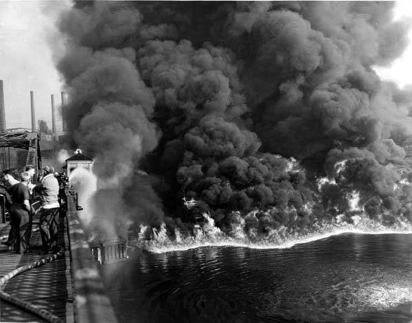 Thick black plumes of smoke rise from a Cuyahoga River ablaze in 1952.
(James Thomas / The Cleveland Press Collection)
