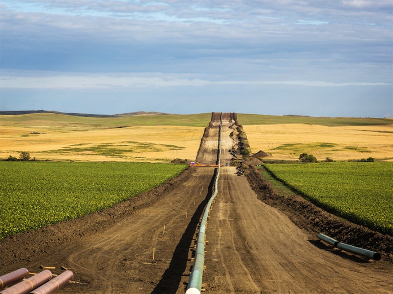 The DAPL (Dakota Access Pipeline) being installed between farms, as seen from 50th Avenue in New Salem, North Dakota.
(Tony Webster / CC BY-SA 2.0)