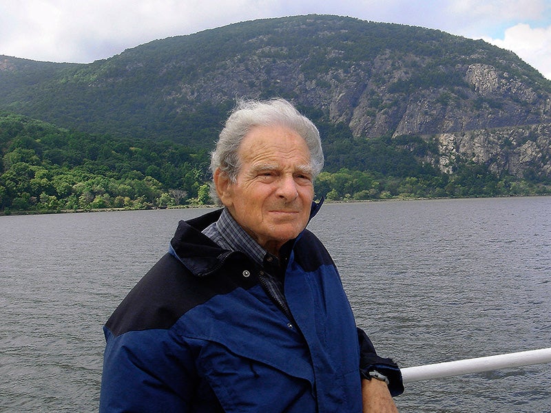 David Sive on the Hudson River, with Storm King Mountain in the background.