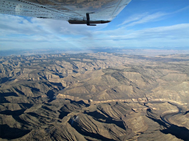 An airplane passes over Desolation Canyon, UT.