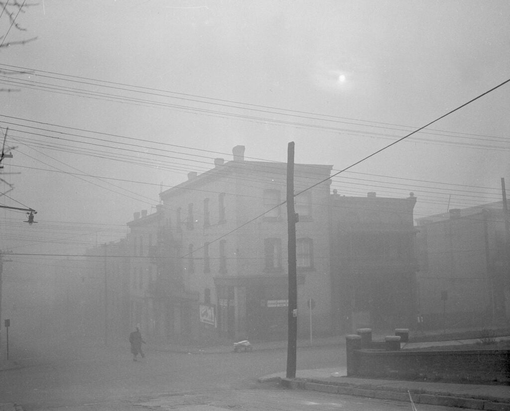 The main business district of Donora, Pa., seen Oct. 30, 1948, where 20 persons were reported dead and 7,000 others — half the town's population -- sickened from the effects of the smog. Sunlight is virtually obliterated by the thick low hanging pollution.