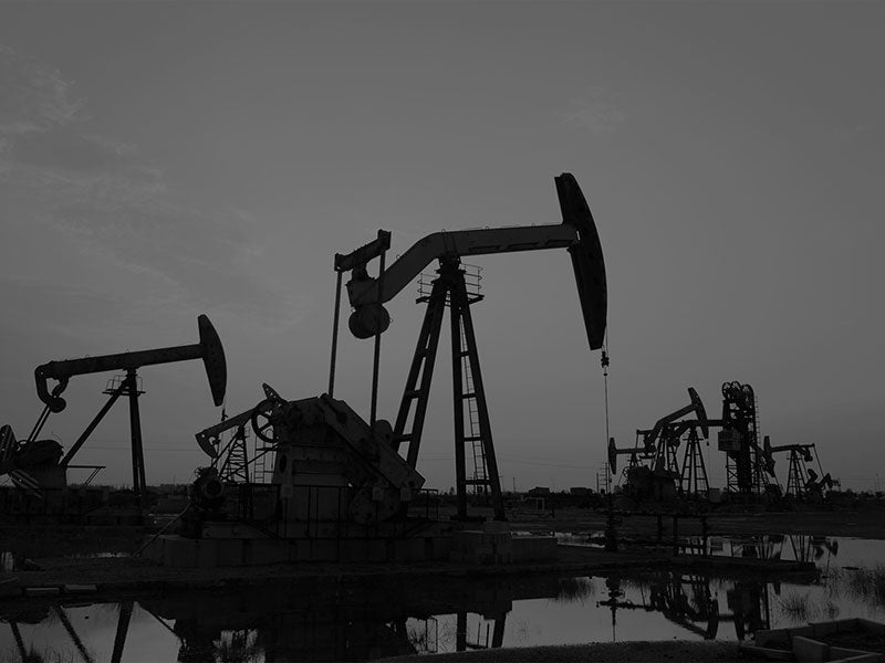 Silhouette of oil and gas drilling rigs.