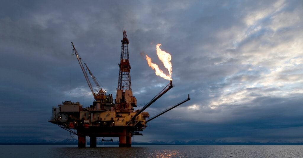 A natural gas flare from an offshore oil drilling rig in Cook Inlet, Alaska.