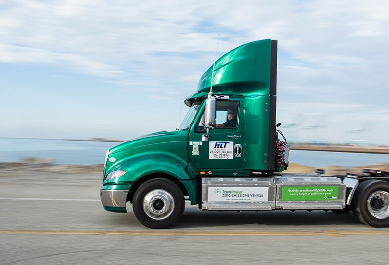 An electric heavy duty truck used to move freight at the Port of Long Beach.