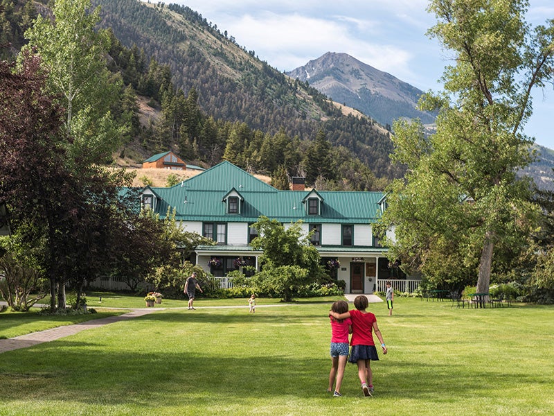 The front lawn of the world famous. locally owned, Chico Hot Springs Resort with Emigrant Peak in background.