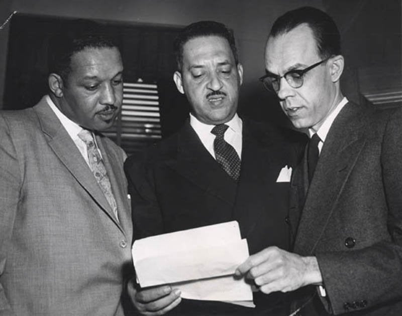 Harold P. Boulware, Thurgood Marshall, and Spottswood W. Robinson III argued against school segregation before the Supreme Court in Brown v. Board of Education.