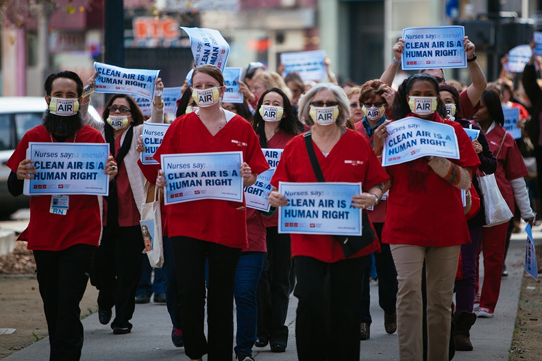 Members of the California Nurses Association march to a rally outside the EPA&#039;s public hearing on updating ozone protections, in Sacramento, CA, on February 2, 2015.