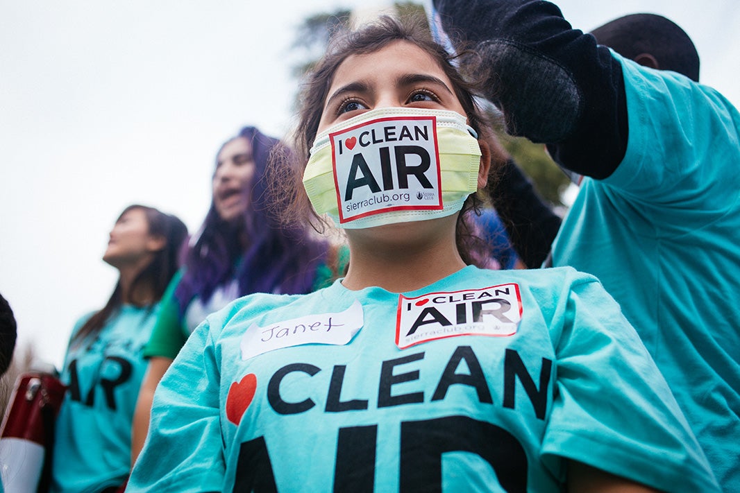 Janet, a fifth grader from Oakland, California, wears a symbolic mask, as she attends a public hearing held by the Environmental Protection Agency on strengthening the ozone pollution standard, February 2, 2015.