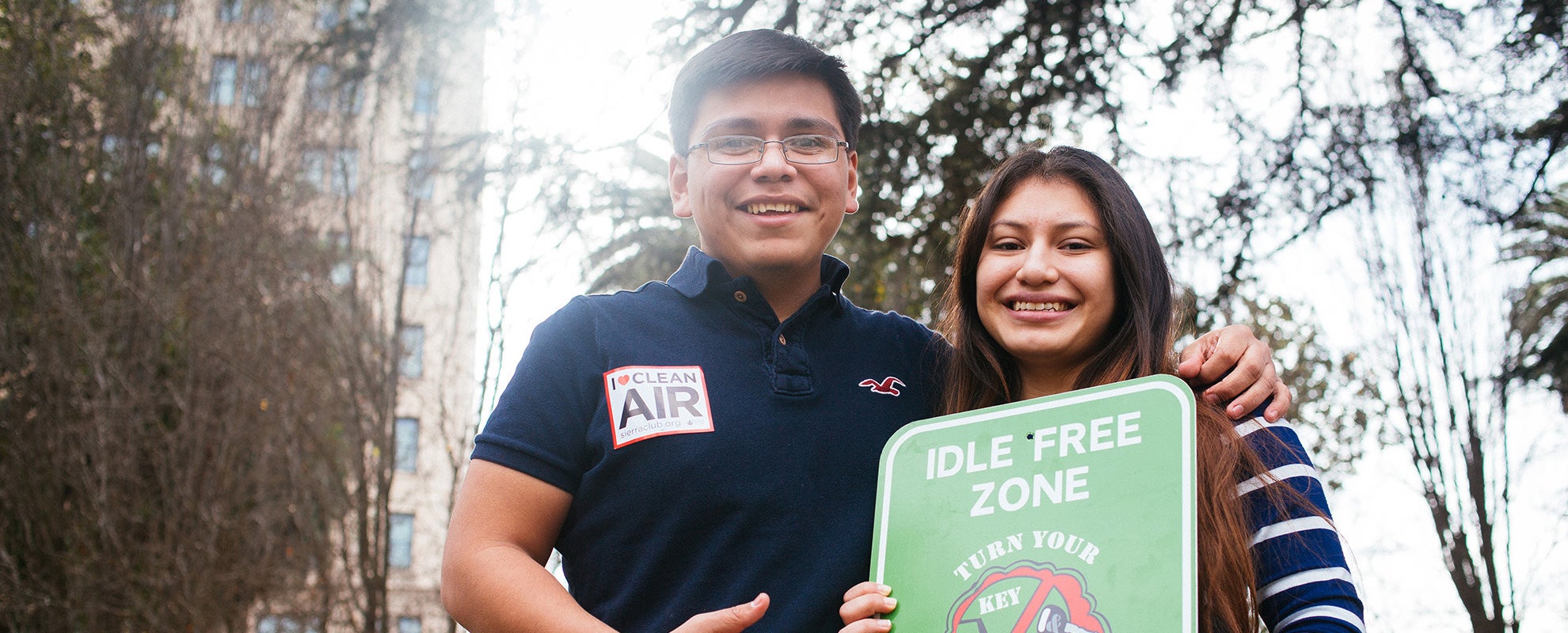 Oscar Garcia and Kimberly Garcia of Reno, NV, hold a sign outside of the EPA&#039;s public hearing in Sacramento on proposed ozone standards.