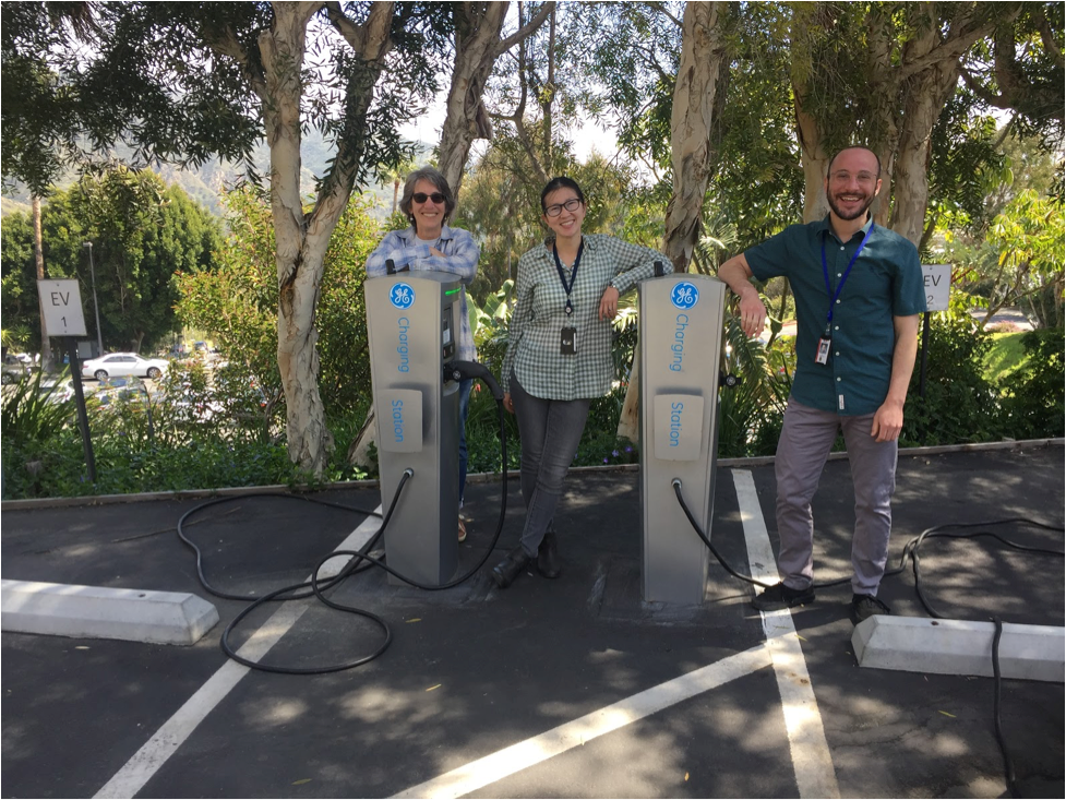 Electric car drivers Stephanie Tiffany, Shanying Cui, and Ari Weinstein (from left to right) purchased their vehicles after their workplace installed charging stations.
