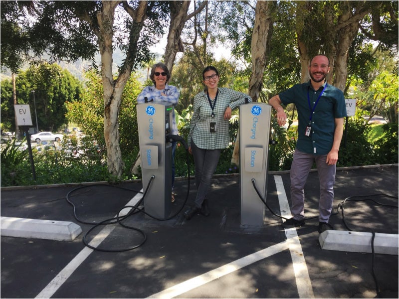 Electric car drivers Stephanie Tiffany, Shanying Cui, and Ari Weinstein (left to right) purchased their vehicles after their workplace in Southern California installed charging stations.