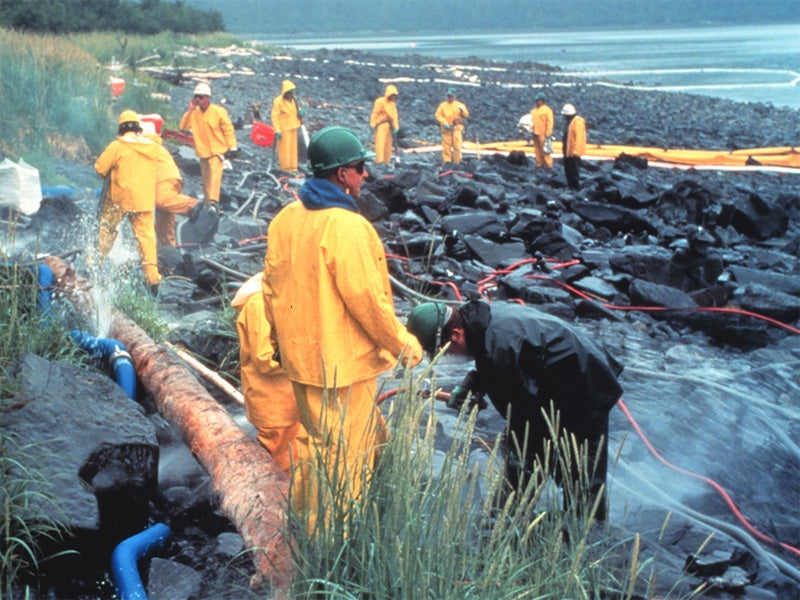 Pressure cleaning rocks on intertidal zone in Alaska's Prince William Sound area.