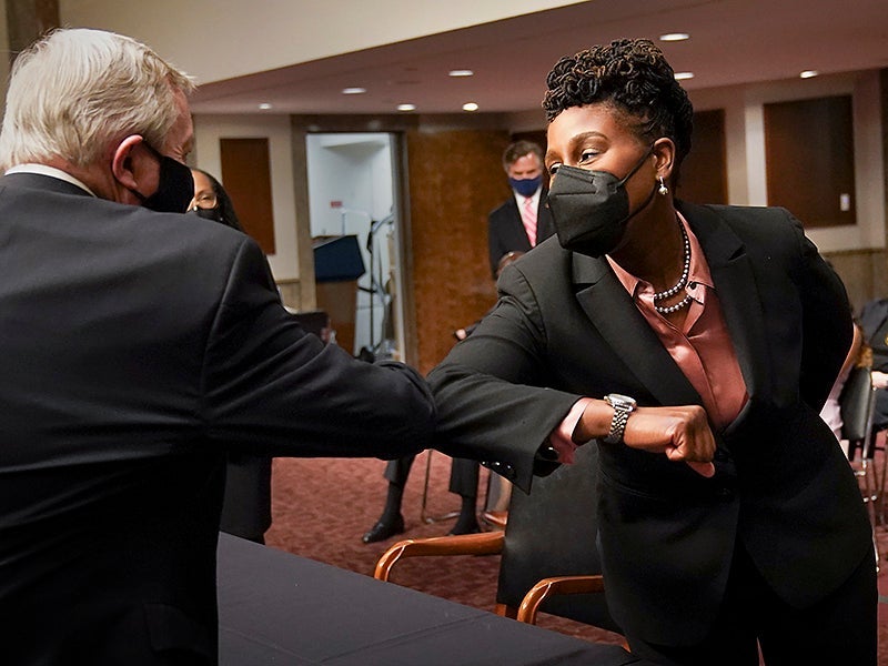 Candace Jackson-Akiwumi greets senators after being nominated in 2021 to be a U.S. Circuit Judge for the Seventh Circuit.
(Kevin Lamarque / Pool via Getty Images)