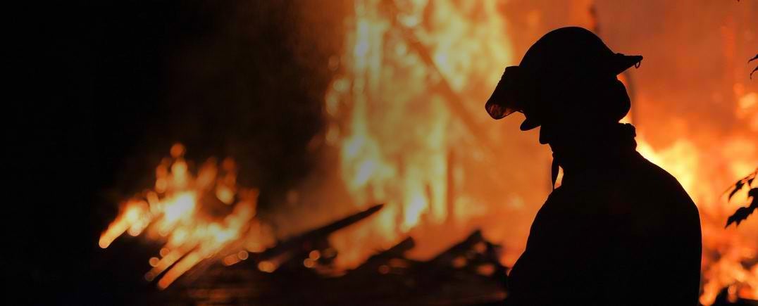 Silhouette of a firefighter.