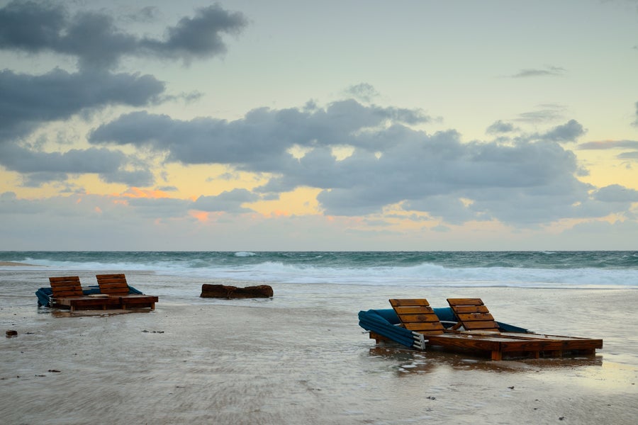 Beach chairs floating away in high Florida tide