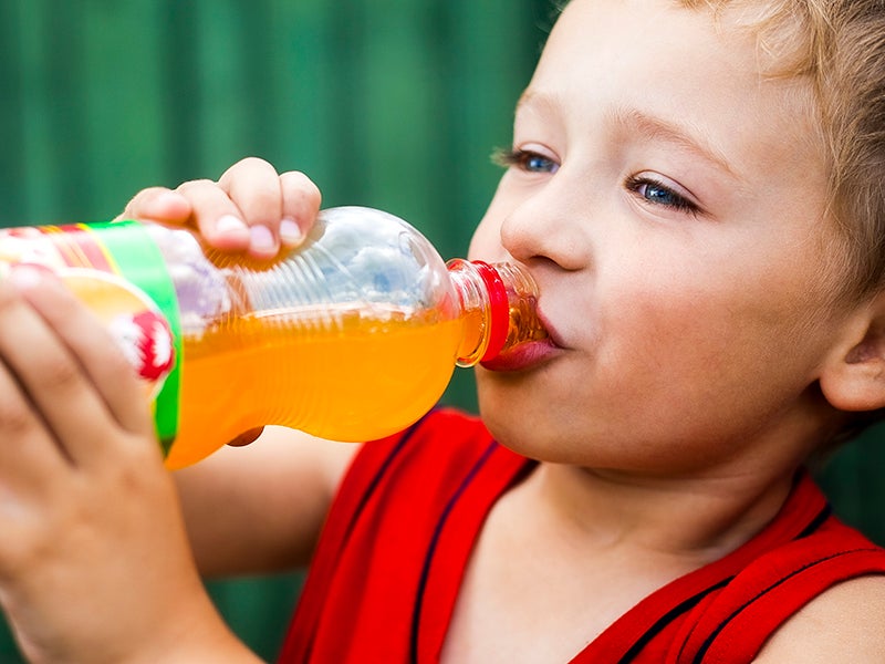 A child drinks a soda.
