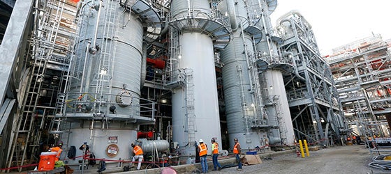 Employees work on a section of the Mississippi Power Co. carbon capture plant in DeKalb, Miss. (Rogelio V. Solis / AP)