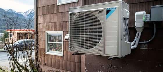An outside unit to a heat pump system outside a home in Juneau, Alaska. (Michael Penn for Earthjustice)