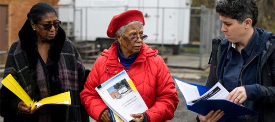 Dr. Dolores Leonard, center, speaks at New Mt. Hermon Church in the 48217 ZIP code, where there is an air quality monitor. The stop at the church was part of a tour of toxic sites located throughout Southwest Detroit, Ecorse, and River Rouge. (Brittany Greeson for Earthjustice)