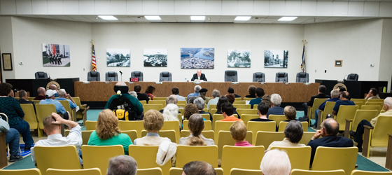 Community members listen at a West Virginia Public Service Commission hearing in 2017 to oppose the sale of the Pleasants Power Plant. (Roger May for Earthjustice)