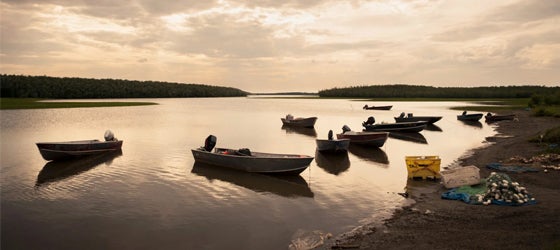 Fishing skiffs tied up on the riverbank along the Kuskokwim River in the village of Akiachak, Alaska. (Design Pics Inc / Alamy)