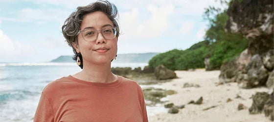 Monaeka Flores, photographed on Inapsan Beach on Guam, where her family had ranched the land for generations. (Nathan Topasna for Earthjustice)