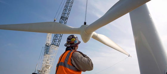 A crane lifts a wind turbine rotor onto a tower north of Abilene, Texas. (Robert Nickelsberg / Getty Images)