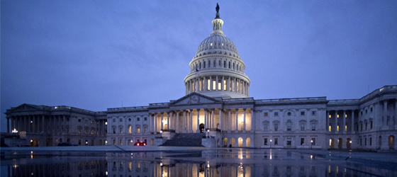 The U.S. Capitol is reflected in a fountain in Washington, D.C.  (Andrew Harrer / Bloomberg Creative via Getty)