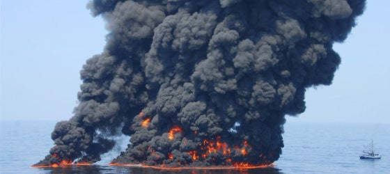 A controlled burn of oil from the Deepwater Horizon/BP oil spill sends towers of fire hundreds of feet into the air over the Gulf of Mexico on June 9, 2010. (Petty Officer First Class John Masson / US Coast Guard)