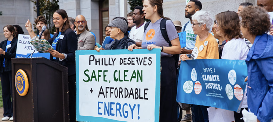 Philadelphians rally at City Hall in support of a proposed settlement with the city’s gas utility to lower the increase in heating bills and start expanding clean energy in the city. (Jess Benjamin for Earthjustice)