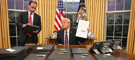 US President Donald Trump signs executive orders in the Oval Office of the White House in Washington, DC, on January 20, 2025. (Jim Watson / AFP via Getty Images)