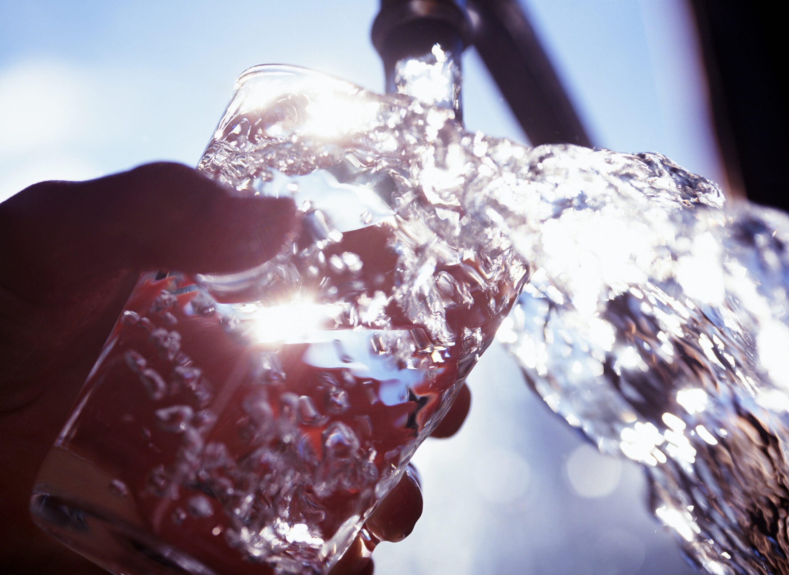 A glass filled with drinking water.