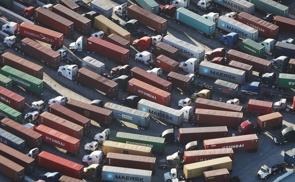 Trucks haul shipping containers at the Port of Los Angeles, the nation's busiest port. Their emissions create diesel death zones along freight lines and freeways throughout the state. Trucks produce the pollution for 40% of California’s unhealthy smog problem.